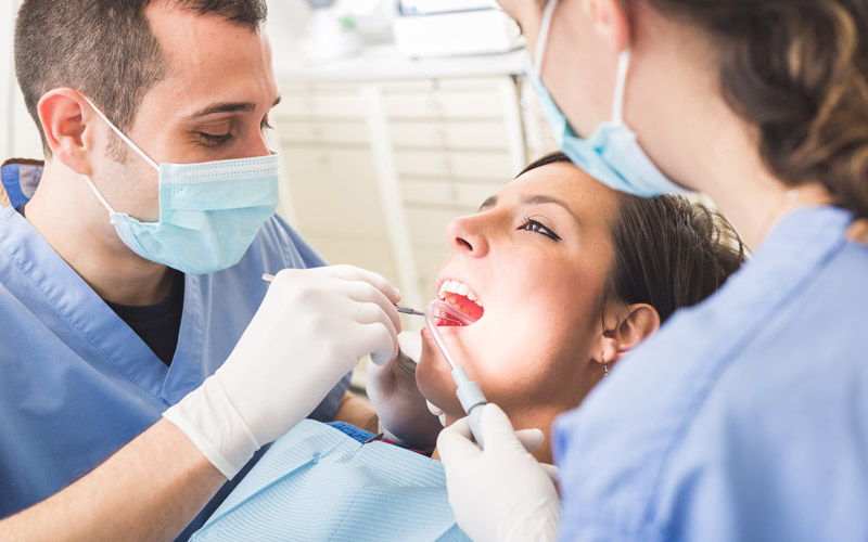 Kitsilano dentist - kitsilano dental services - Dentist examining patient